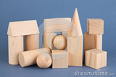 Wooden geometric shapes on a blue Stock Photo