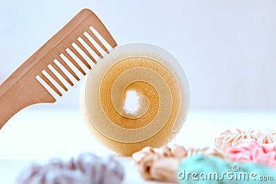 Wooden hairbrush and Lot of Colorful silk Scrunchies on white. Luxury Hairdressing tools and accessories. Hair Scrunchies, Elastic Stock Photo