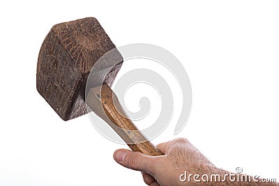 Wooden hammer held in a man& x27;s hand. Carpenters accessories Stock Photo