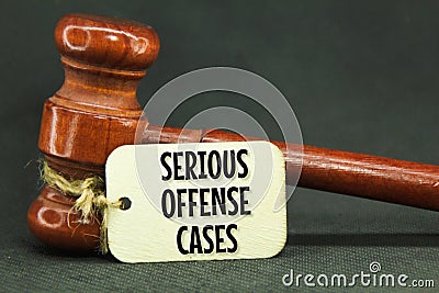 wooden hammers and wooden tags with the words serious offense cases Stock Photo