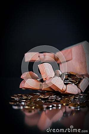 Wooden hand holding polish coins. Stock Photo