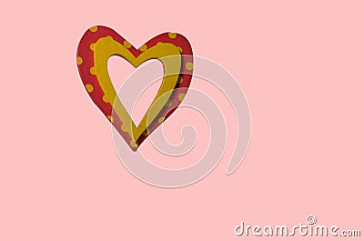 Wooden heart in the form of a frame on a pink background Stock Photo