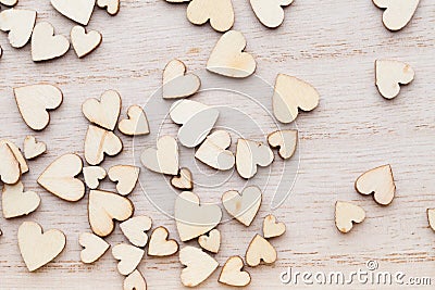 Wooden hearts, on the heart background. Stock Photo