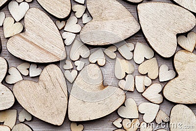 Wooden hearts, on the heart background. Stock Photo