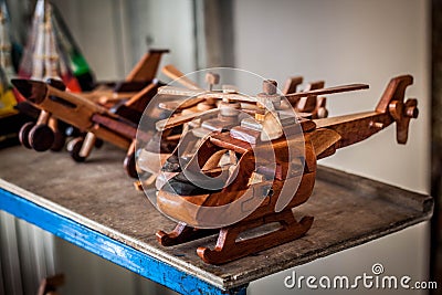 A wooden helicopter toys line in store market in malioboro jogja yogyakarta indonesia Stock Photo