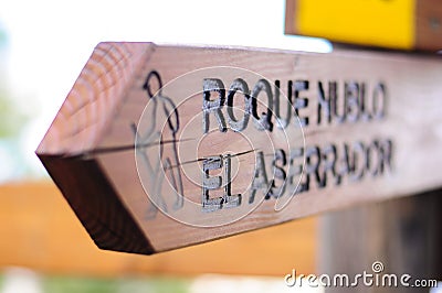 Wooden hiking pathways sign of Roque Nublo Cloudy Rock one of the biggest natural volcanic crags in the world. Located in the Stock Photo