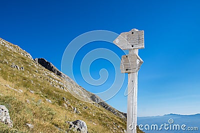 Wooden hiking trail sign with scenic view Stock Photo