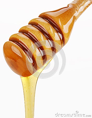 Wooden honey drizzler Stock Photo