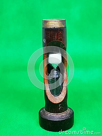 Wooden hourglass with metal head Stock Photo