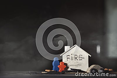 Wooden house, colourful figurines red bricks and a car Stock Photo