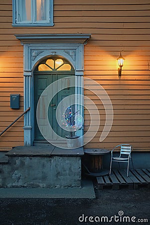 wooden house patio with a quirky christmas tree Stock Photo