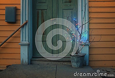 wooden house patio with a quirky christmas tree Stock Photo