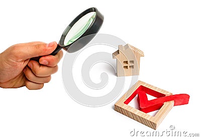 Wooden house and a tick in the box. concept of finding a home an Stock Photo