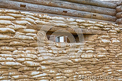 Sandbag wall with shooting hole Stock Photo