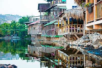 Wooden houses built over a salty lagoon at Playa el Tunco, El Sa Stock Photo