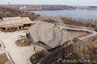 Wooden houses in the National Reserve `Zaporizhzhia Sich` on the island of Khortytsia in Zaporizhzhia. Ukraine. Stock Photo