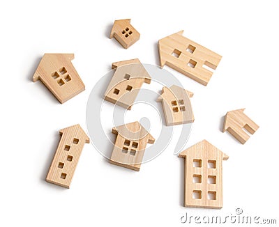 Wooden houses on a white background. The concept of rising prices for housing or rent. Growing demand for housing and real estate. Stock Photo