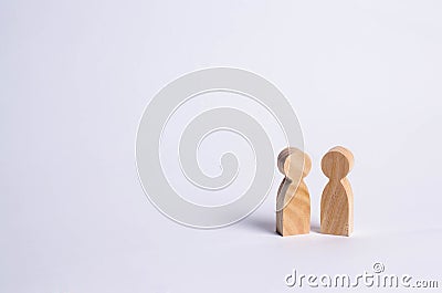 wooden human figures stand together. Social concept, family Stock Photo