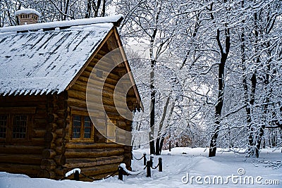 Wooden hut in winter forest Stock Photo