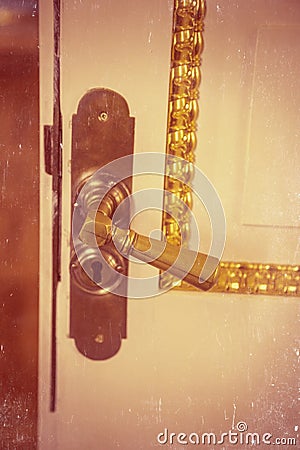 Brass vintage handle on white door Stock Photo