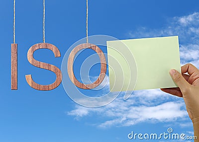 Wooden ISO text Stands for International Organization for Standardization hanging on rope. Stock Photo