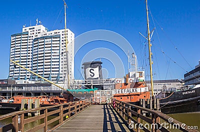 Wooden jetty leading to a historic ship in the Museumshafen of Bremerhaven Editorial Stock Photo