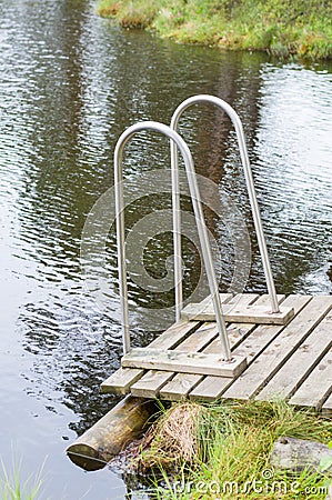 Wooden jetty with railings to the muskeg Stock Photo