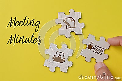 Wooden jigsaw puzzle with meeting minutes symbols. Business concept Stock Photo