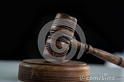 Wooden judge`s gavel. A modern law office. Stock Photo