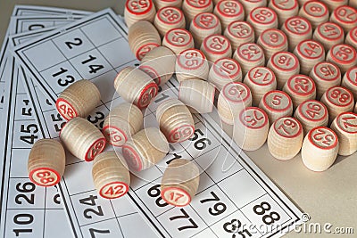 Wooden kegs and cards for a lotto, closeup. Stock Photo