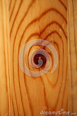 Wooden lacked brown surface macro close abstract texture plate of pine wood with a branch eye knot hole background brown yellow Stock Photo