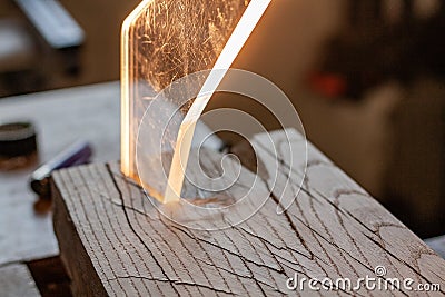 Wooden lamp. Lighting and woodery. Glass shard crystal. Woodworking lifestyle, organic eco friendly design elements. Stock Photo