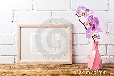 Wooden landscape frame mockup with pink orchid Stock Photo