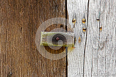 Wooden latch on a wooden door Stock Photo
