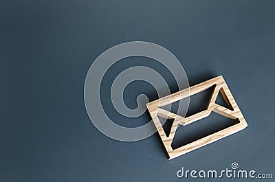 Wooden letter envelope. Contact concept. Postal correspondence. Mail notification. Communication internet technologies. Email. Stock Photo