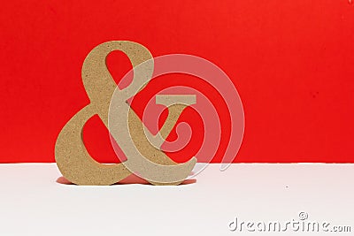 Wooden letter, and sign. red background. Metaphorical for couples love Stock Photo
