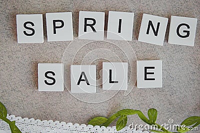 Wooden lettering spring sale, white and green Stock Photo