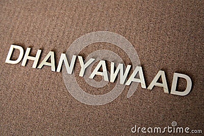 Wooden letters forming the words Dhanyawaad in Hindi Stock Photo