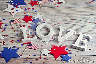 Wooden letters are laid out in the word love, July 4, happy independence day, patriotism, memory of veterans, the concept Stock Photo