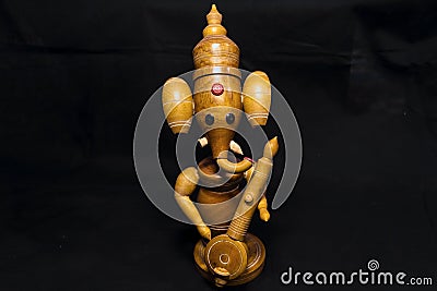 Wooden Lord Ganesha With Black Background. Stock Photo