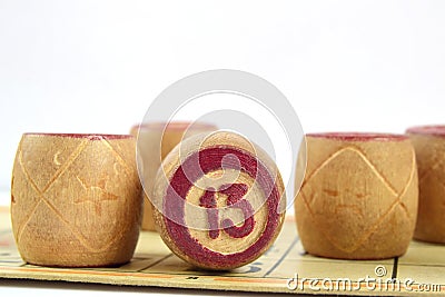 Wooden lotto barrels with numbers. Isolated on a white background. Family bingo game. Conceptual photo Stock Photo