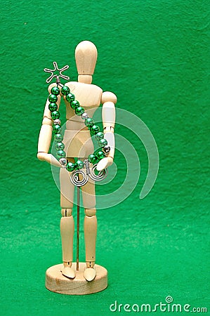 A wooden mannequin display with a christmas tree made out of wire and beads Stock Photo