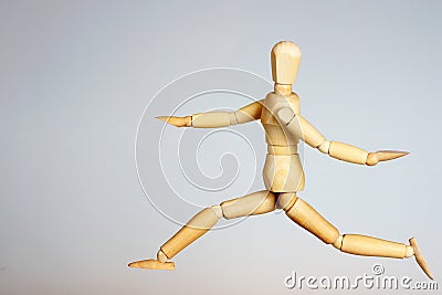 Wooden mannequin running Stock Photo