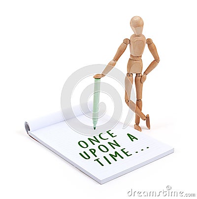 Wooden mannequin writing in scrapbook - Once upon a time Stock Photo