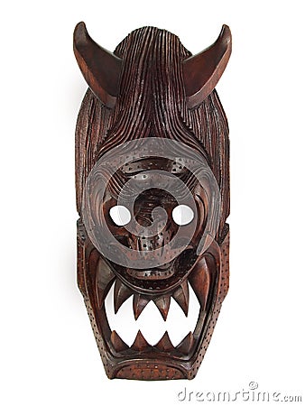 WOODEN MASK WITH HORNS Stock Photo