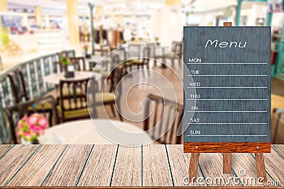 Wooden menu display sign, Frame restaurant message board on wooden table, Blurred image background. Stock Photo