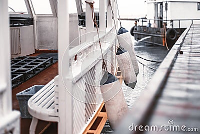 Wooden motorboat moored to a landing stage Stock Photo