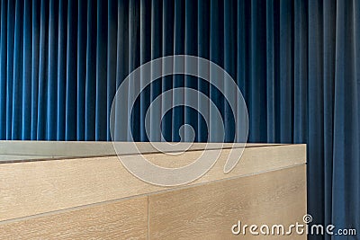 Wooden Office Cubicle Wall Over Blue Curtains Stock Photo