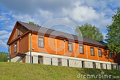 Wooden one-storeyed apartment house on the embankment of the riv Stock Photo
