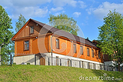 Wooden one-storeyed apartment house on the embankment of the riv Stock Photo